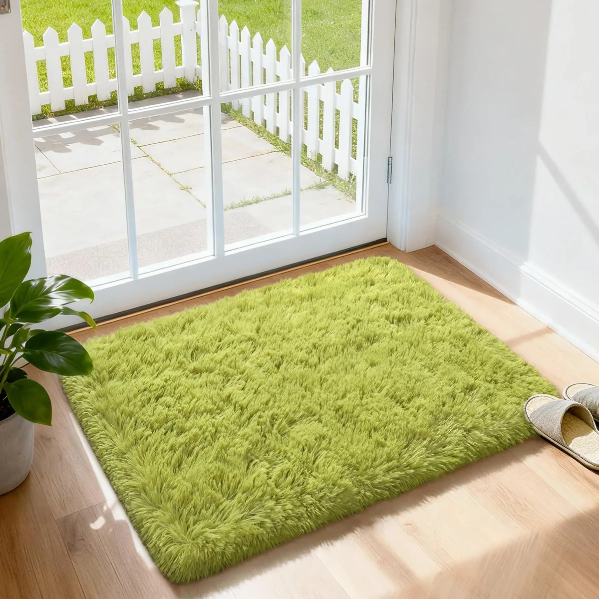Rectangular green shag rug with deep plush pile, 2 by 3 feet