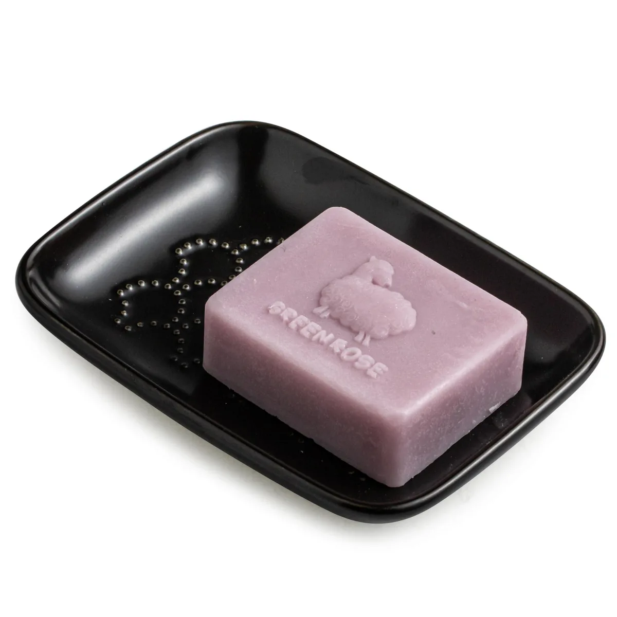 Black rectangular ceramic soap dish with raised scalloped interior and unglazed base