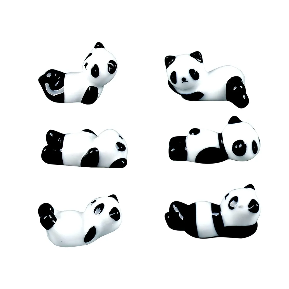 Six small white ceramic pandas with black markings, each in a different pose, sitting on a flat surface