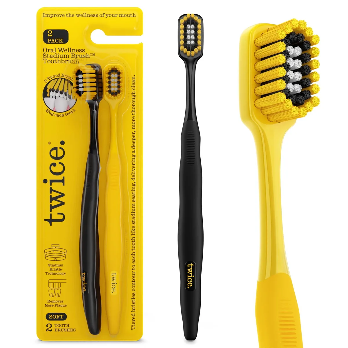 Two multicoloured manual toothbrushes with curved heads and tiered soft bristles
