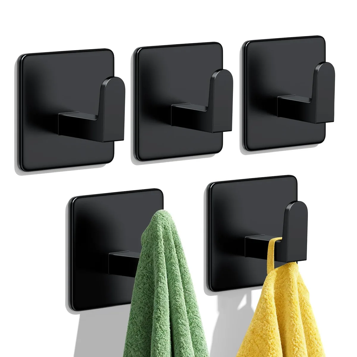 Five black stainless steel adhesive wall hooks in a row