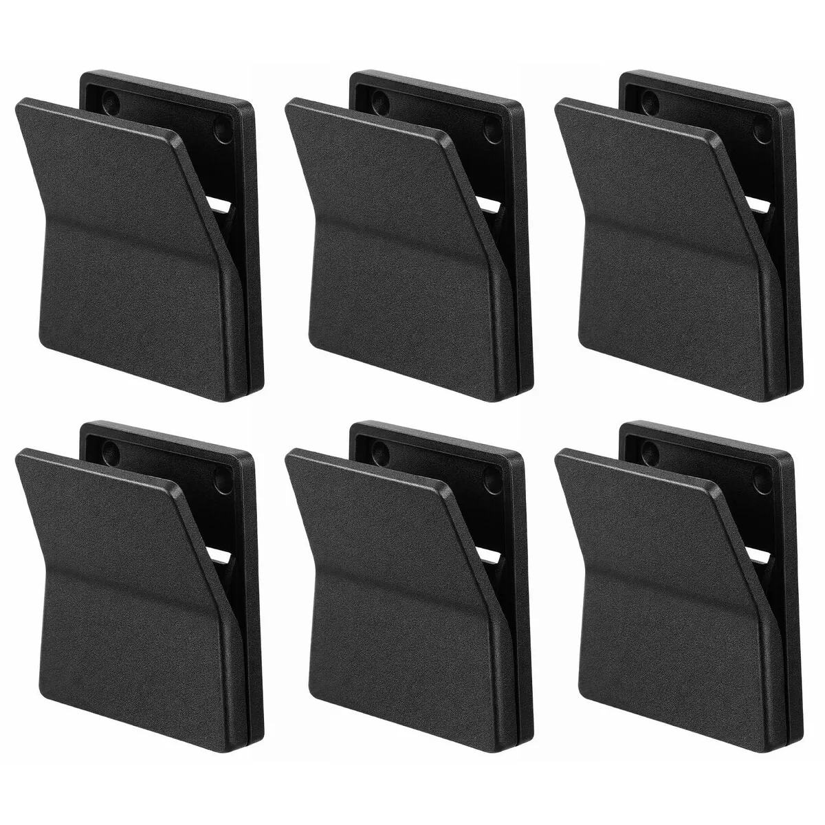 Six black plastic self-adhesive clips on a surface