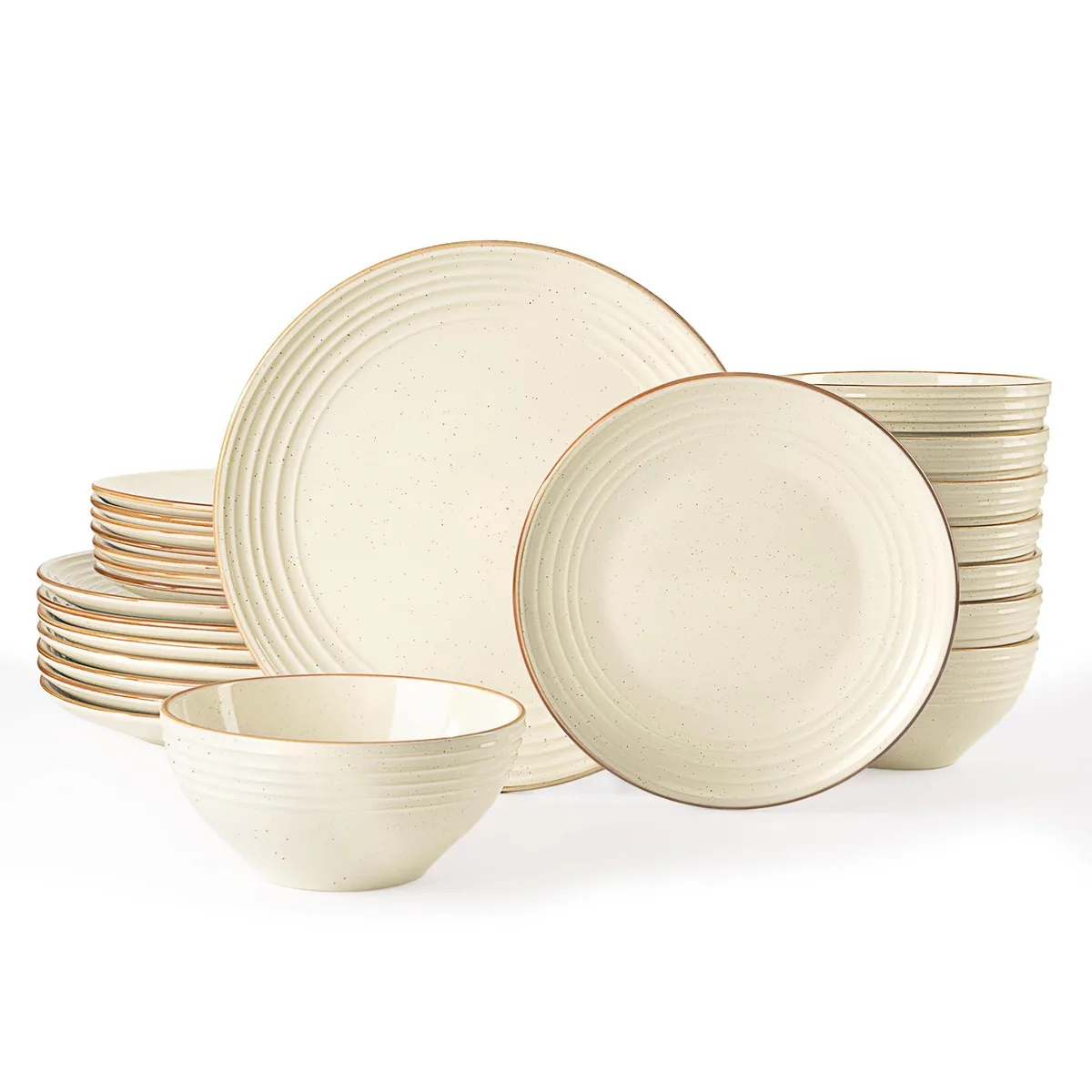 A 24-piece stoneware dinner set in vanilla white with speckled finish and embossed swirls