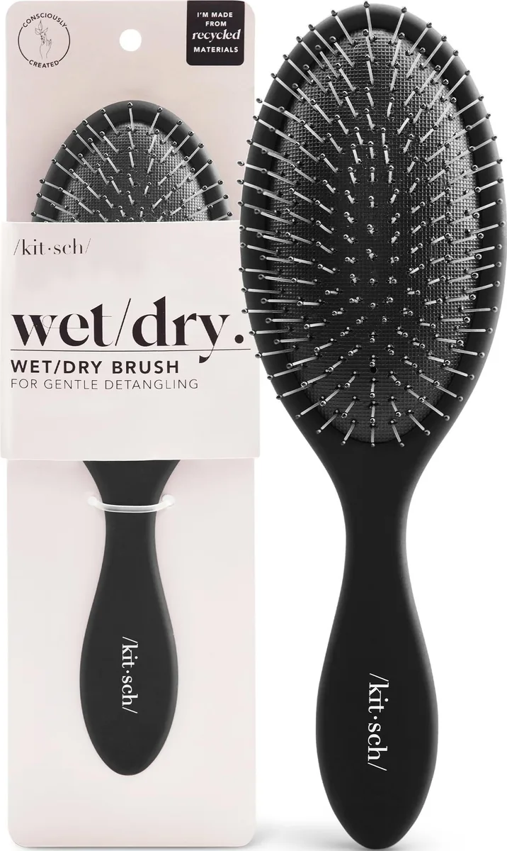 Black flexible detangling hairbrush with non-slip handle, made from recycled plastic