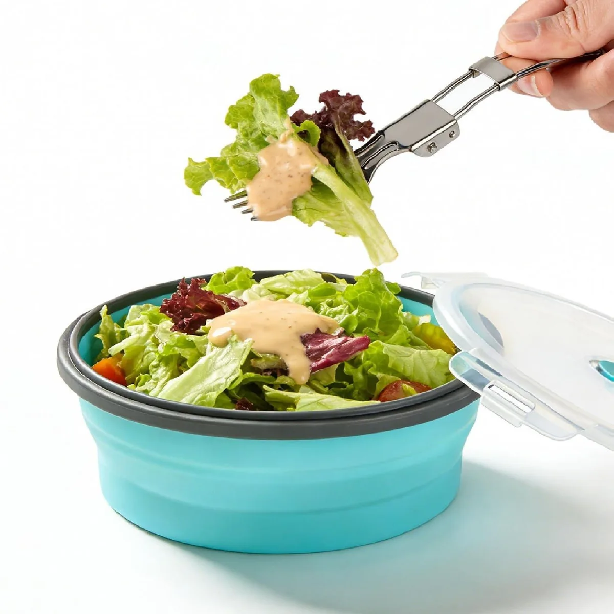 Brown and red collapsible silicone bowl with lid and foldable stainless steel fork