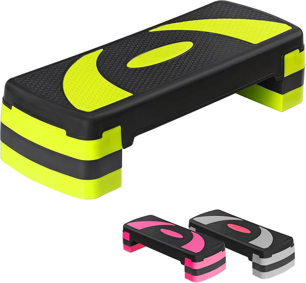 Grey rectangular aerobic step platform with four black risers attached underneath, textured non-slip surface visible