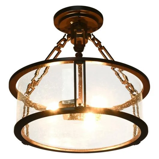 Brown iron flush mount with three seeded glass shades 16 inches wide