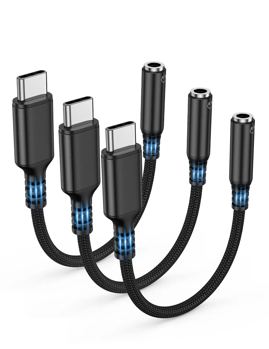 Three black USB-C to 3.5mm audio adapter dongles with metallic plugs and braided cables