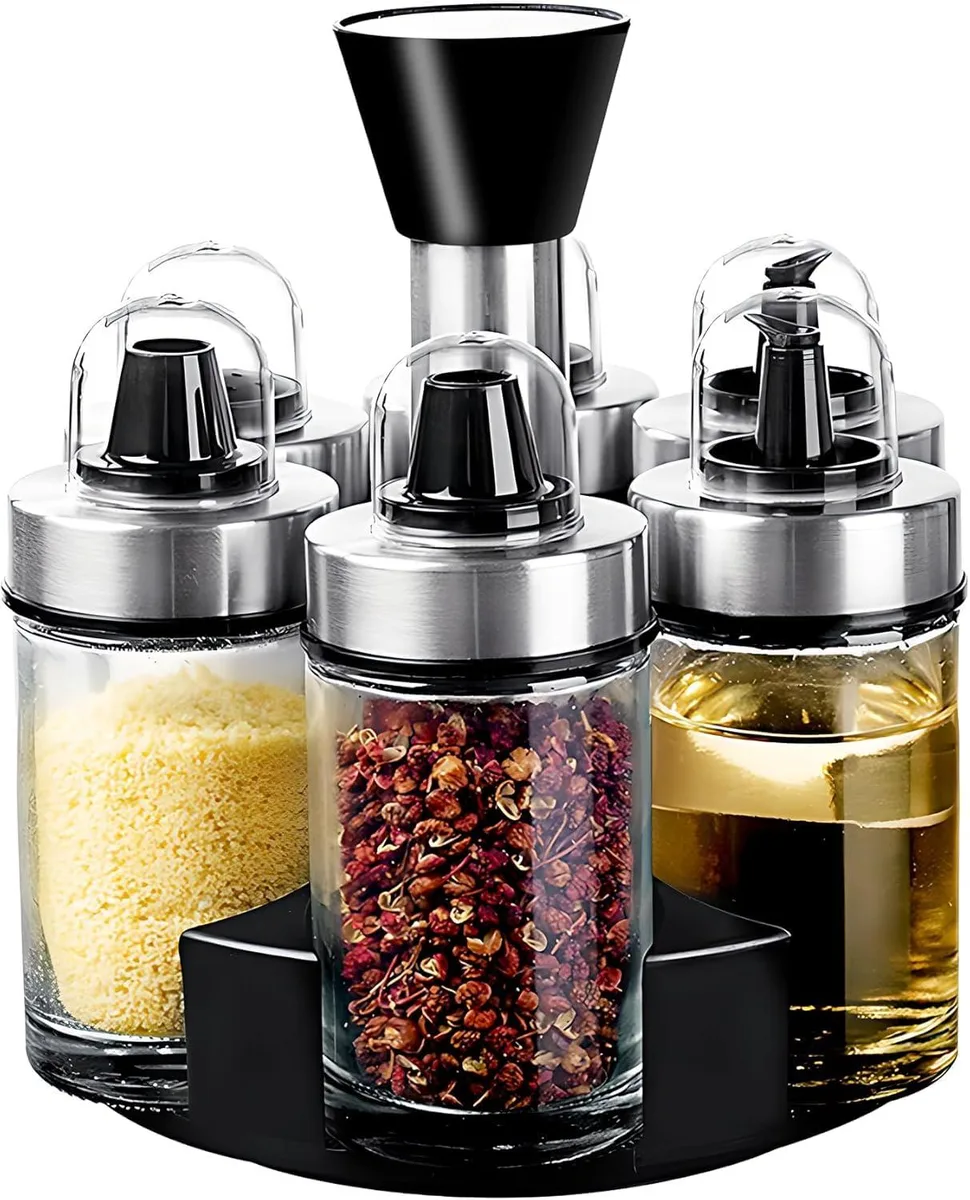 Six clear glass spice jars on a rotating wire base