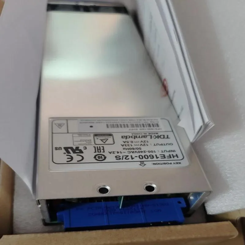 Black rectangular ATX power supply unit with gold certification badge visible on side