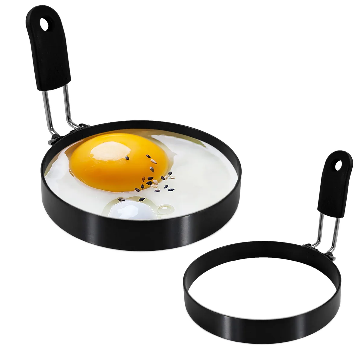 Two stainless steel egg rings 3.5 inches wide with black silicone handles