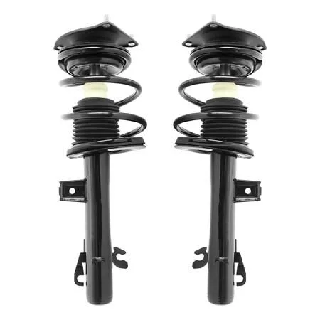 Two silver front strut assemblies with coil springs and top mounts, new in box