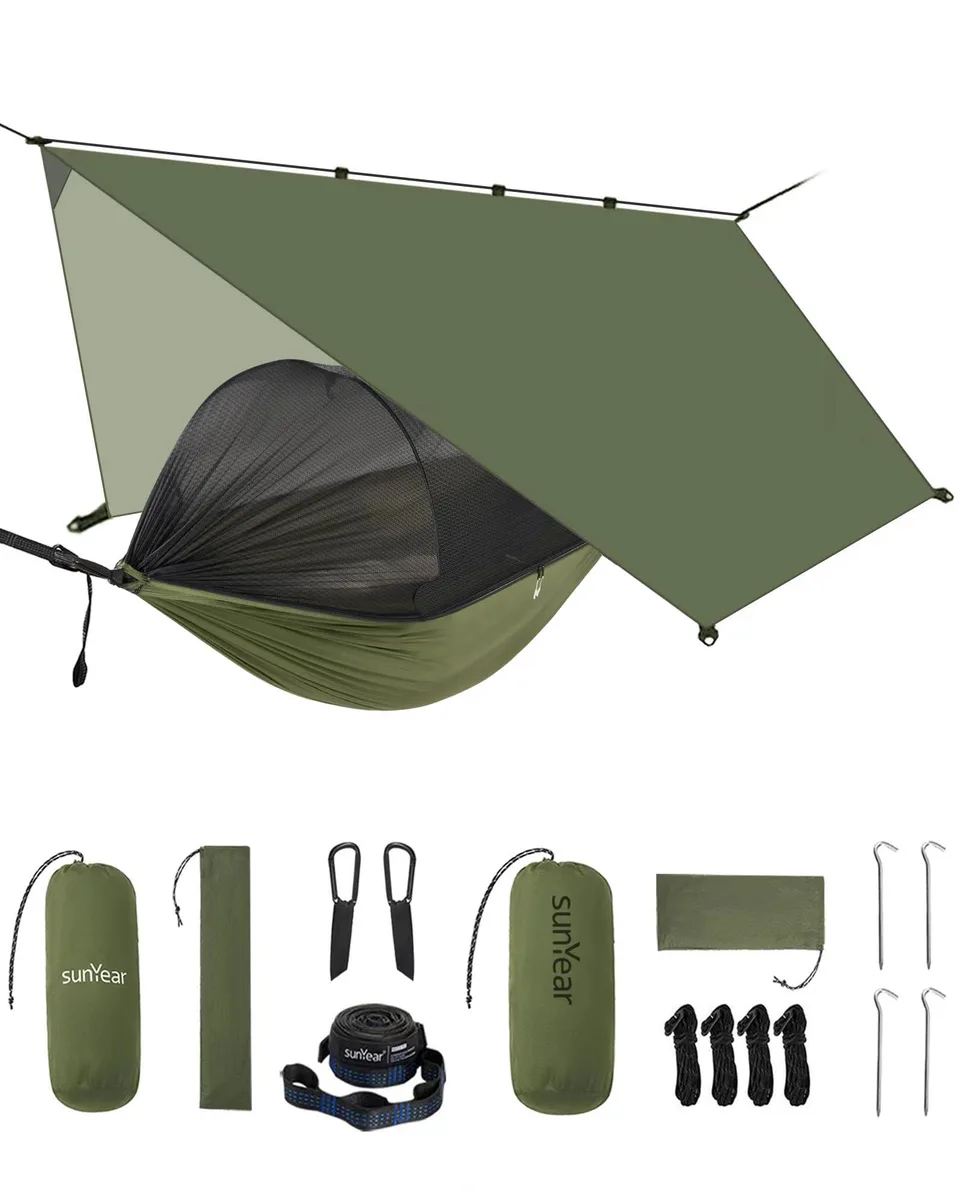 Olive-green nylon hammock with mesh net and rain fly, folded in carry bag