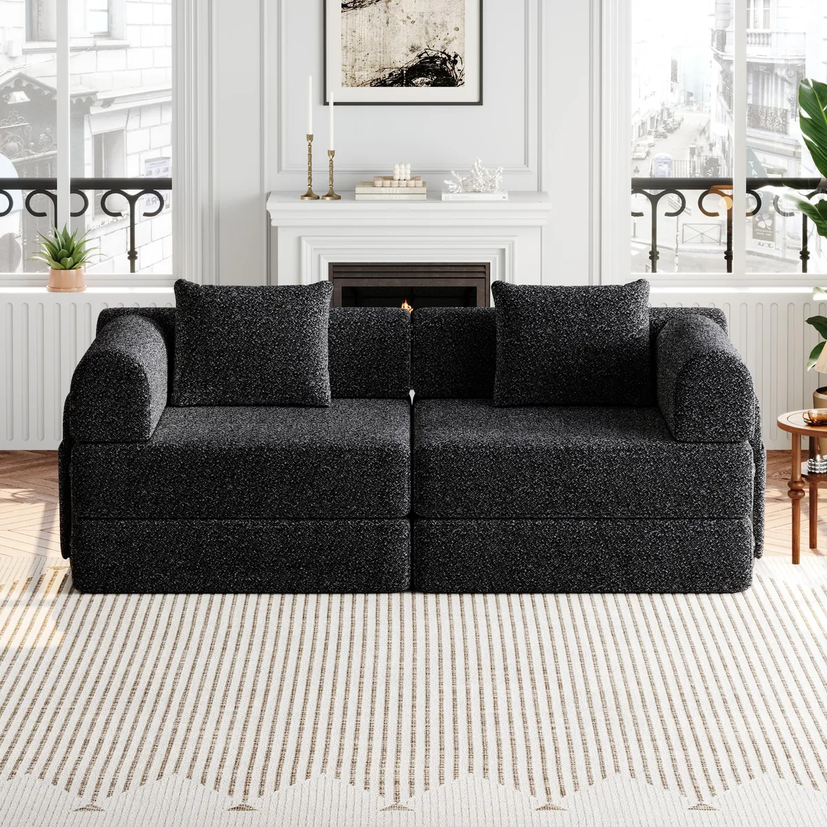 Black chenille convertible sofa bed folded flat with two cushions and side pockets
