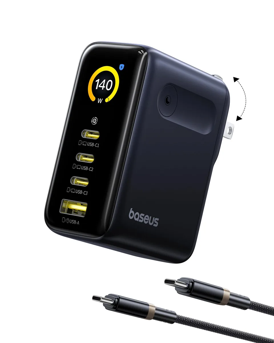 Compact black USB-C AC adapter with foldable prongs and a small display screen