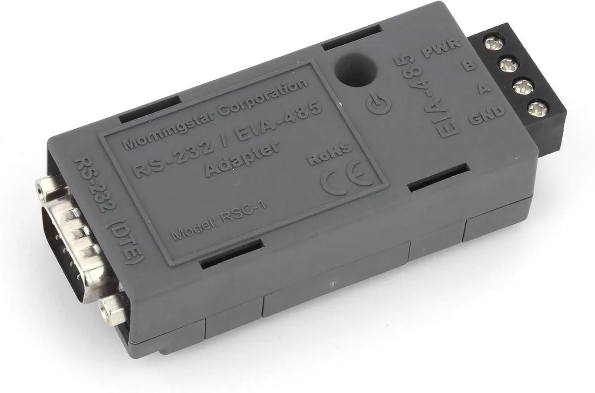 Small rectangular adapter with status LED and RS-232 ribbon cable