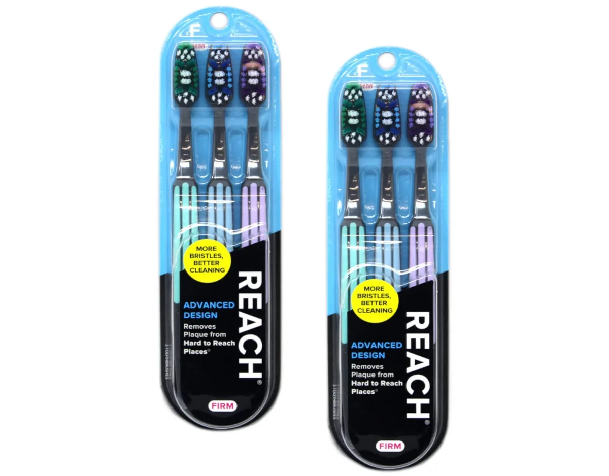 Six multicolour manual toothbrushes with angled heads, rubber grips and tongue cleaners