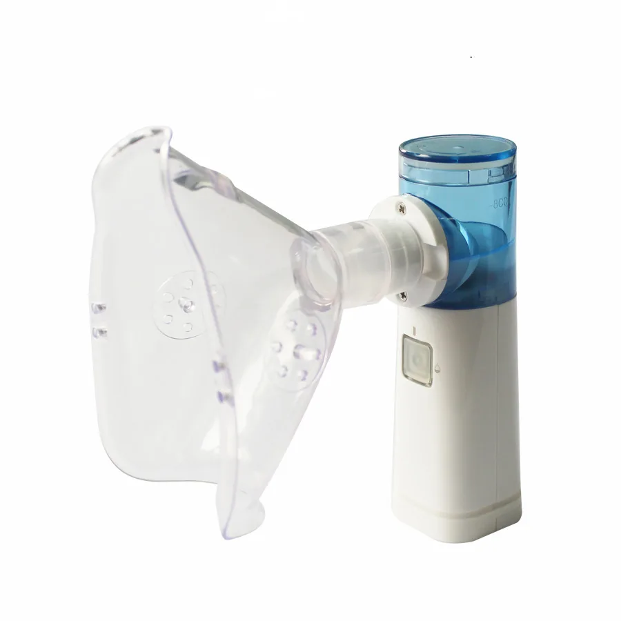 White handheld nebulizer, rectangular with rounded edges, mesh cap on top, single button, USB port visible