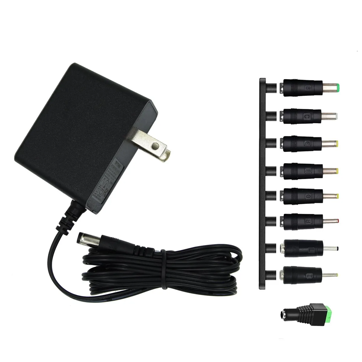 Small black rectangular power adapter with coiled cable and multiple interchangeable barrel tips