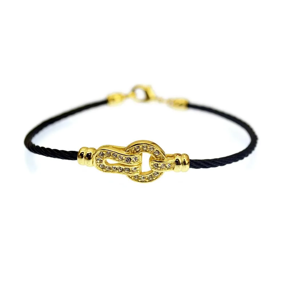 Twisted stainless steel cable bangle with black onyx and gold finish, cubic zirconia centrepiece