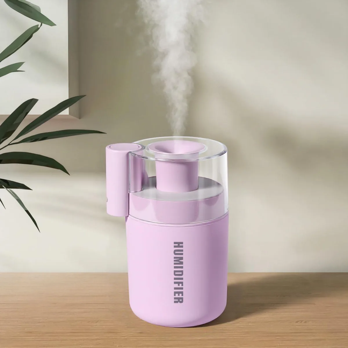 Pink mini humidifier with wood-grain base, flower-shaped mist outlet, USB cable attached