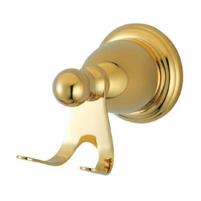 Polished brass robe hook with curved arm extending from wall-mounted base