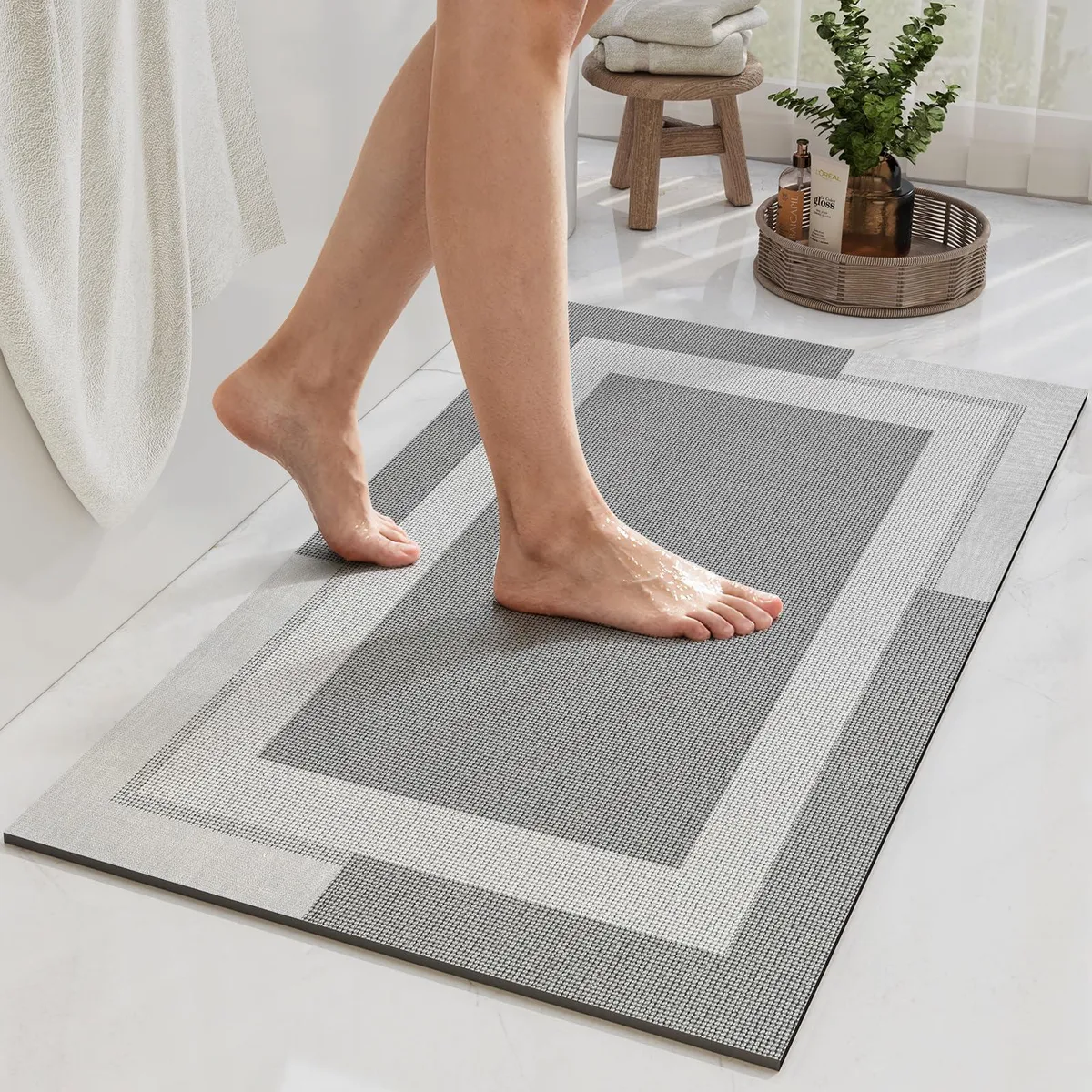 Light grey rectangular bath mat 16 by 24 inches thin profile rubber backing