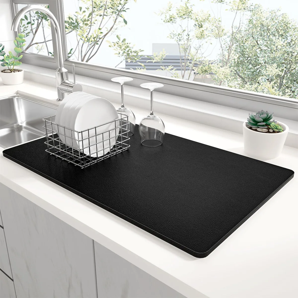 Black rectangular kitchen drying mat 12 by 19 inches with textured absorbent surface and non-slip backing