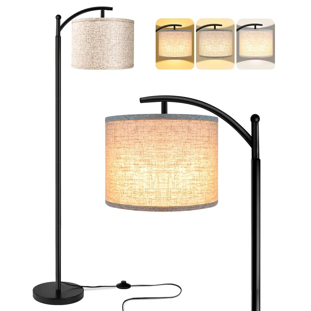 Tall black floor lamp with beige fabric shade and foot switch