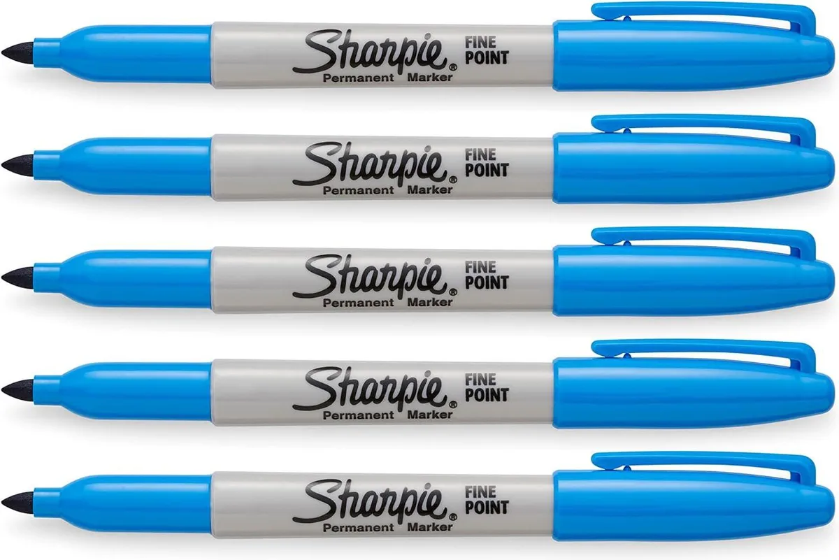 Five blue Sharpie permanent markers with fine points, cylindrical barrels and caps