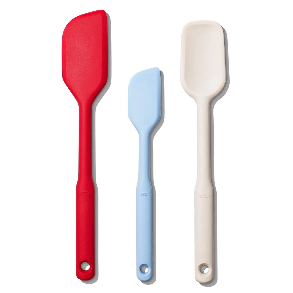 Three silicone spatulas in assorted colours, long handles with soft grips
