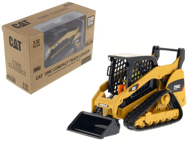 Yellow 1/32 scale CAT 299C track loader diecast model with articulated arms, operator figure