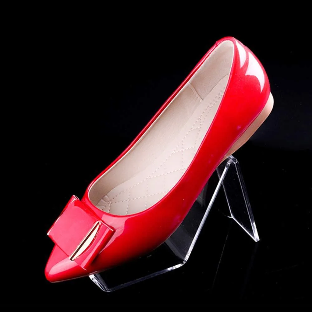 Four clear acrylic shoe display stands, each 15 by 8 cm