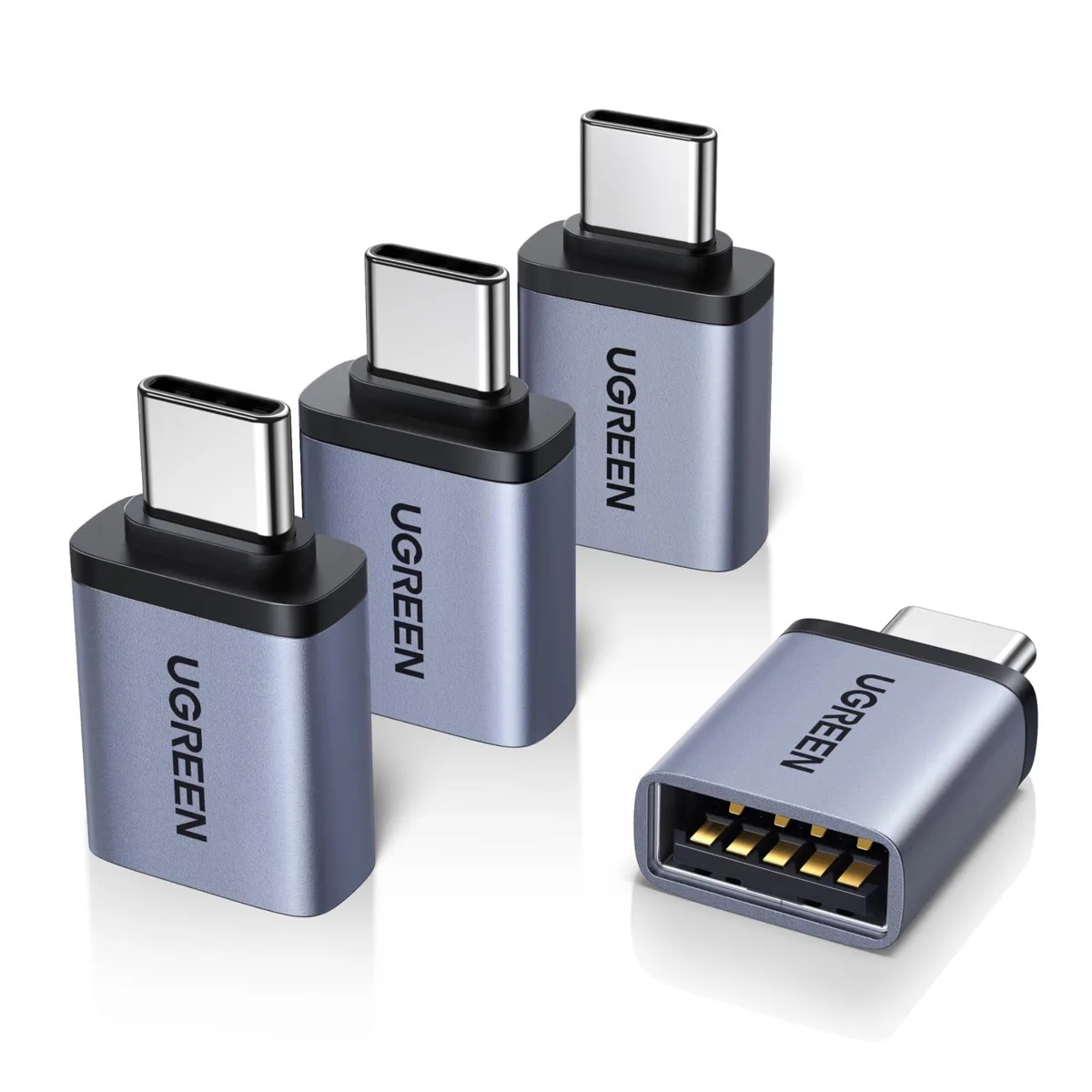 Four space-grey USB-C to USB-A adapters with aluminium shells