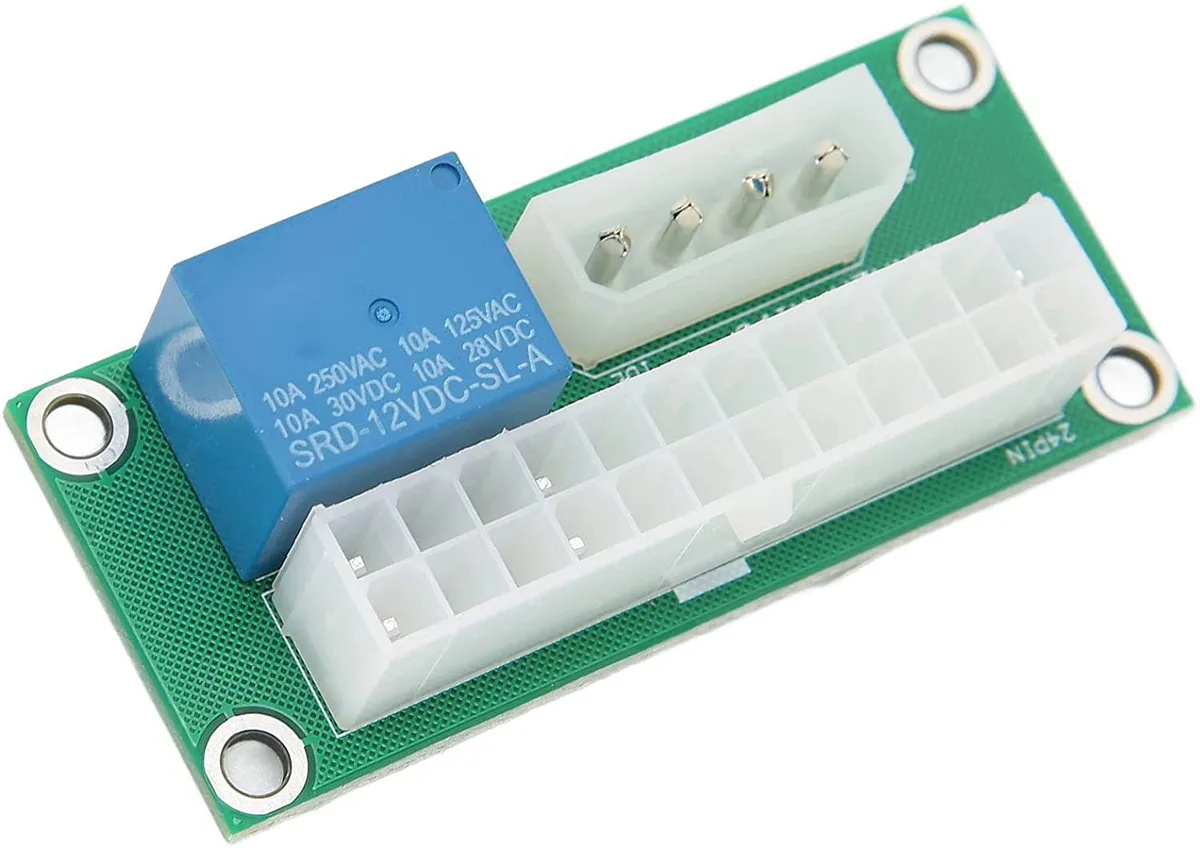 Green PCB adapter board with a 24-pin ATX socket and SATA power connector