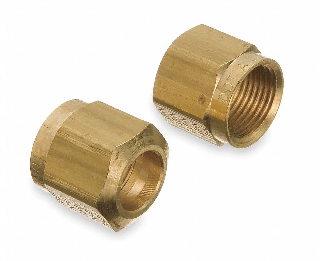 Ten brass compression nuts with hexagonal bodies and threaded interiors