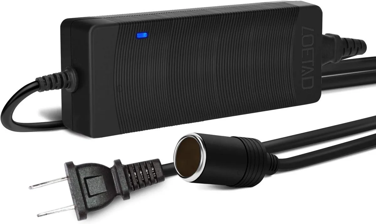Black rectangular AC to DC adapter with cigarette lighter socket and long cable