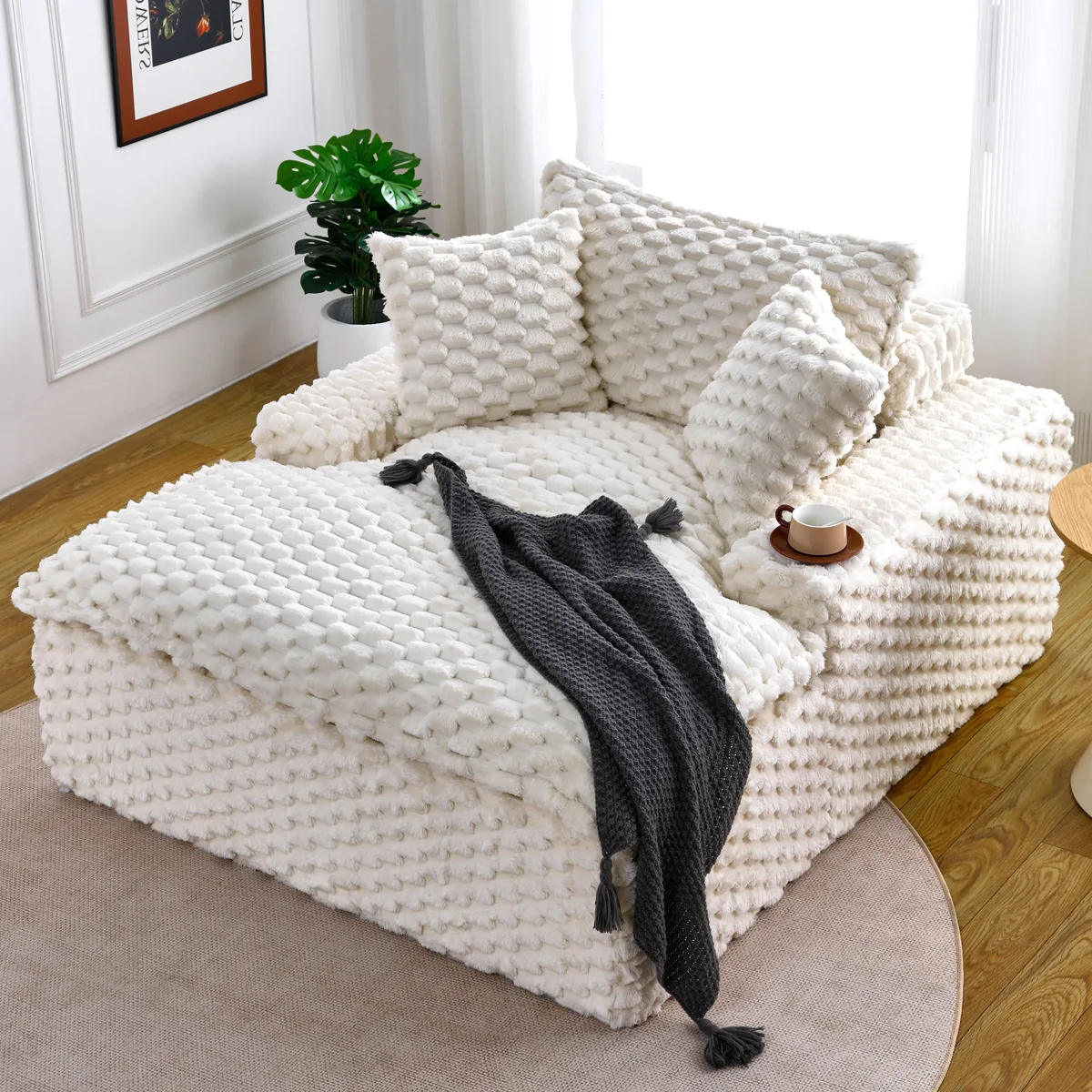 White polyester-blend sofa, 51 inches long, with two pillows and one backrest