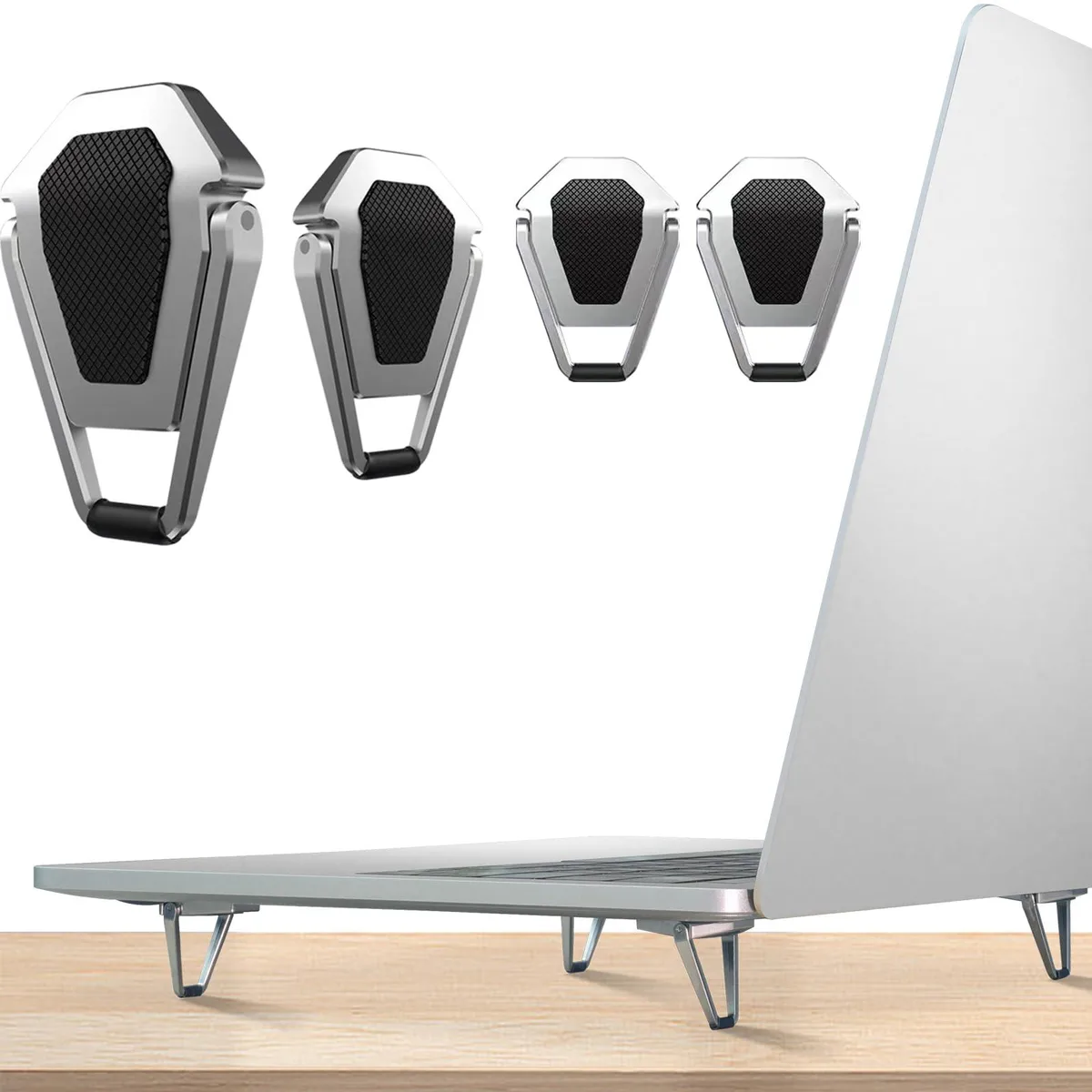 Four silver zinc-alloy laptop riser legs folded flat on a surface