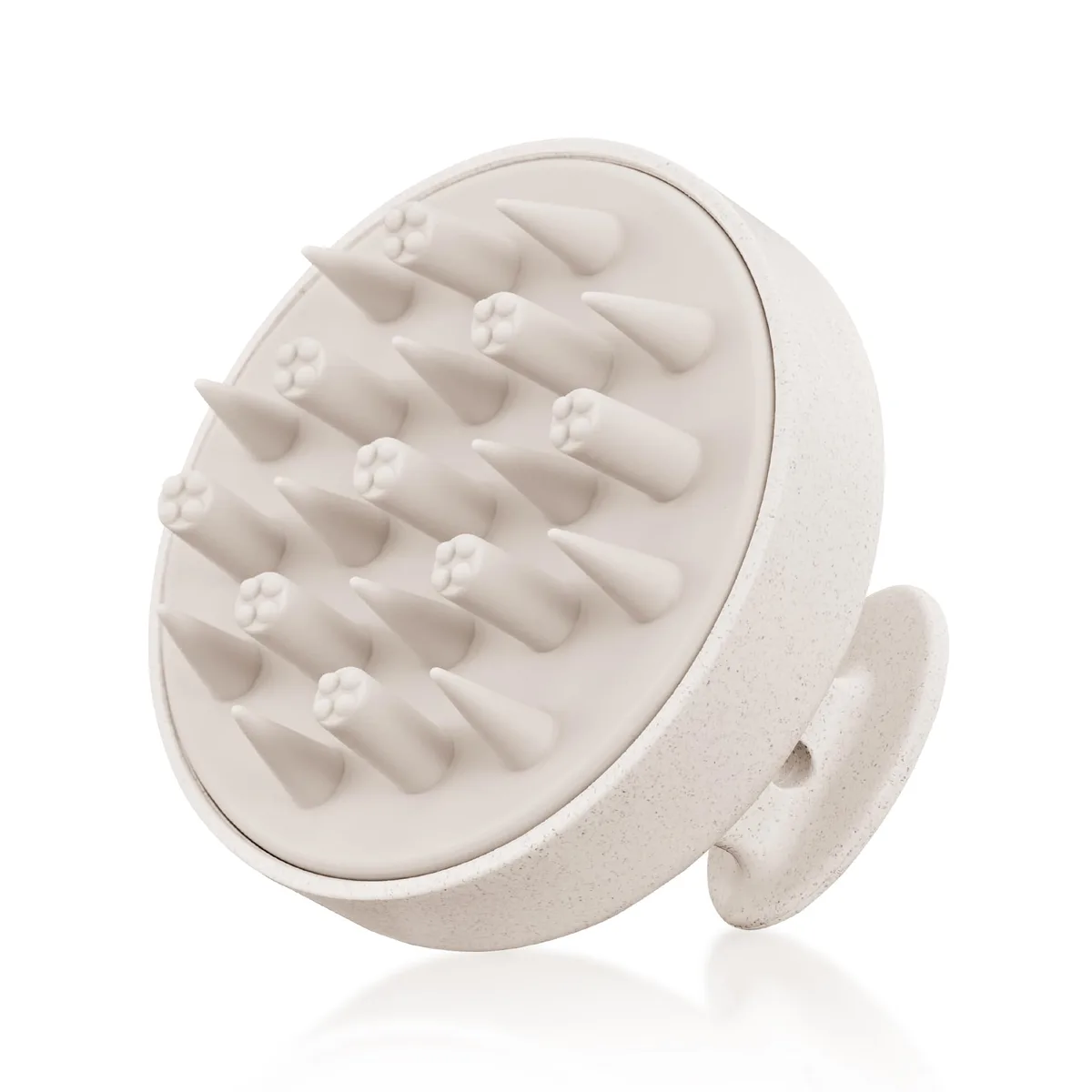 Beige palm-sized scalp massager with soft silicone bristles and wheat straw handle