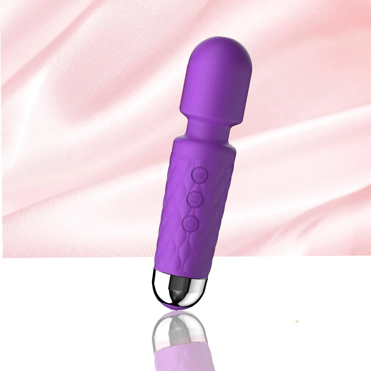 Purple handheld mini massager, smooth silicone finish, compact rectangular shape
