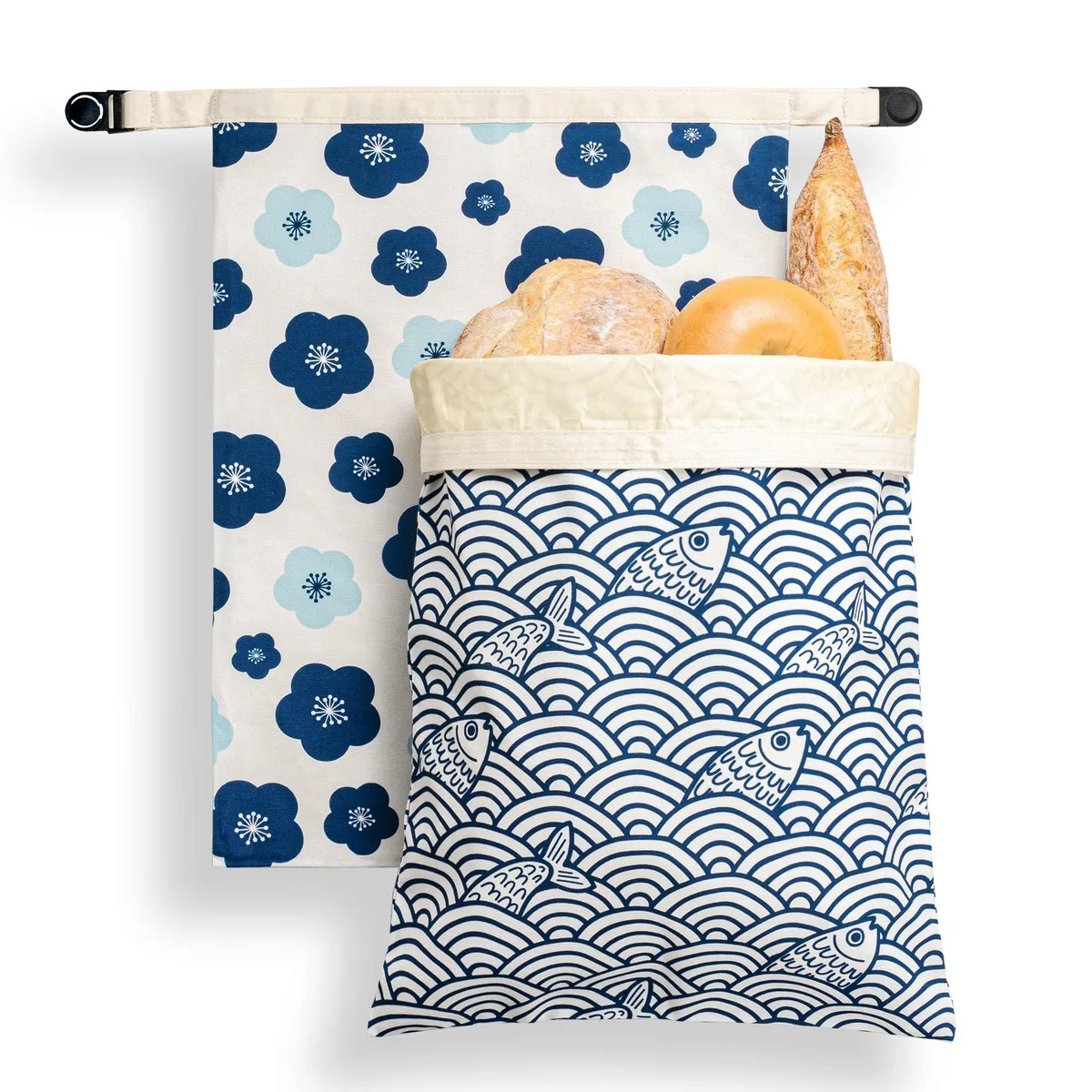 Two beige cotton beeswax bags with roll-top closure and 15 inch laptop compartment