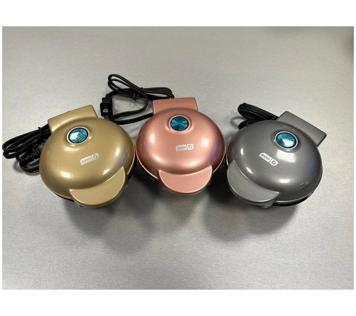 Three compact metallic waffle makers with non-stick plates