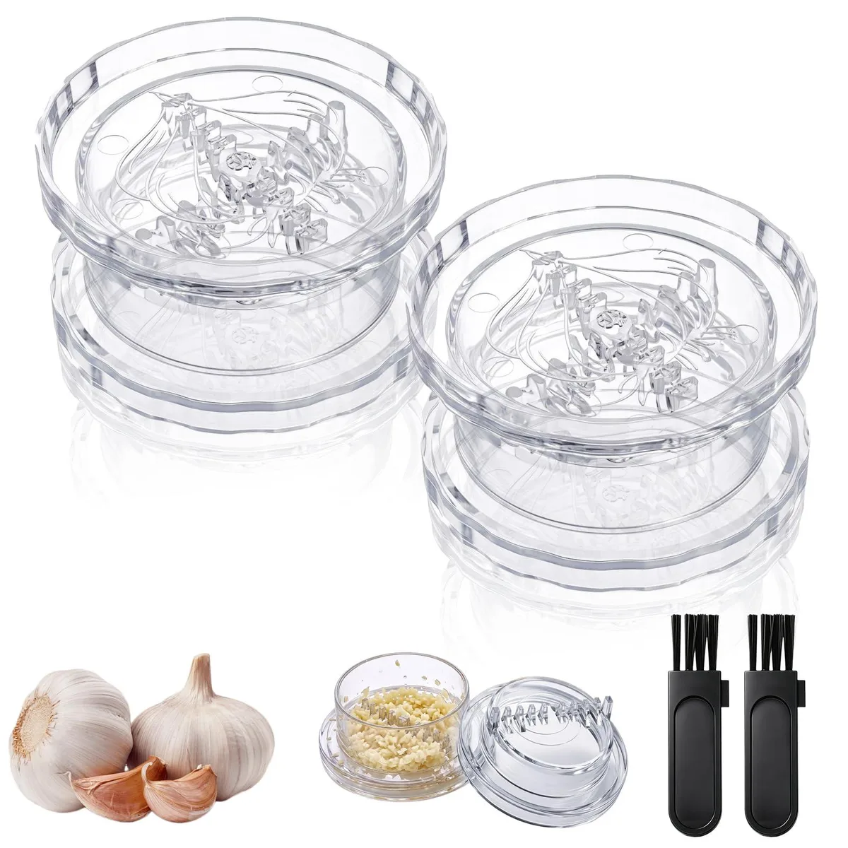 Two clear plastic garlic twisters, cylindrical with twist-apart design