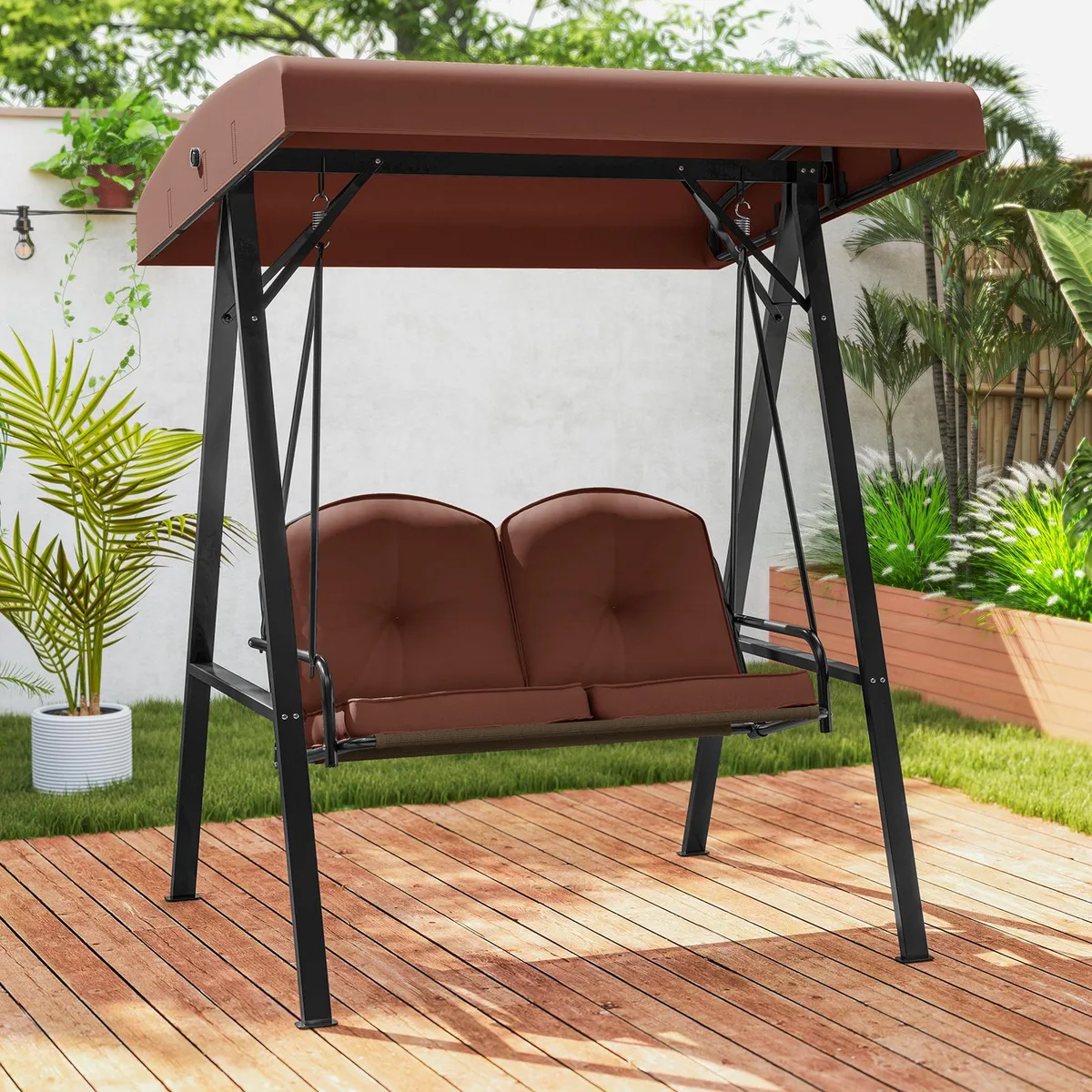 Brown two-seat porch swing on black A-frame metal stand with adjustable grey canopy and beige cushions