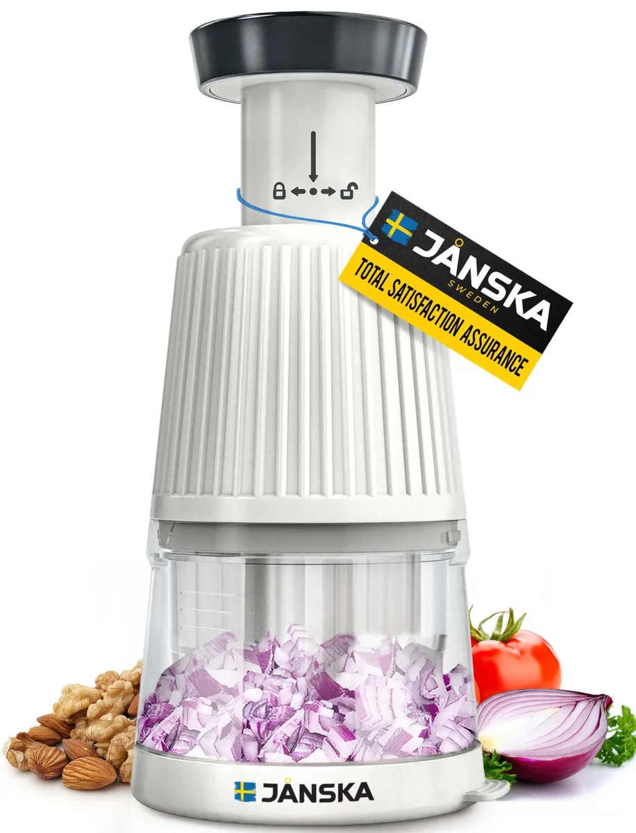 White compact manual food chopper with push-down cap, stainless-steel blade grid and clear collection cup