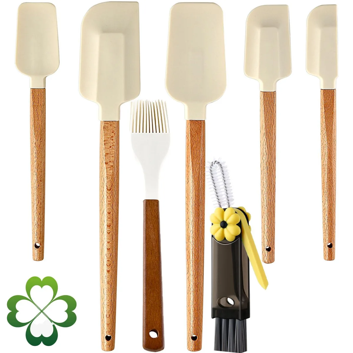 Seven white silicone spatulas with wooden handles on a light surface
