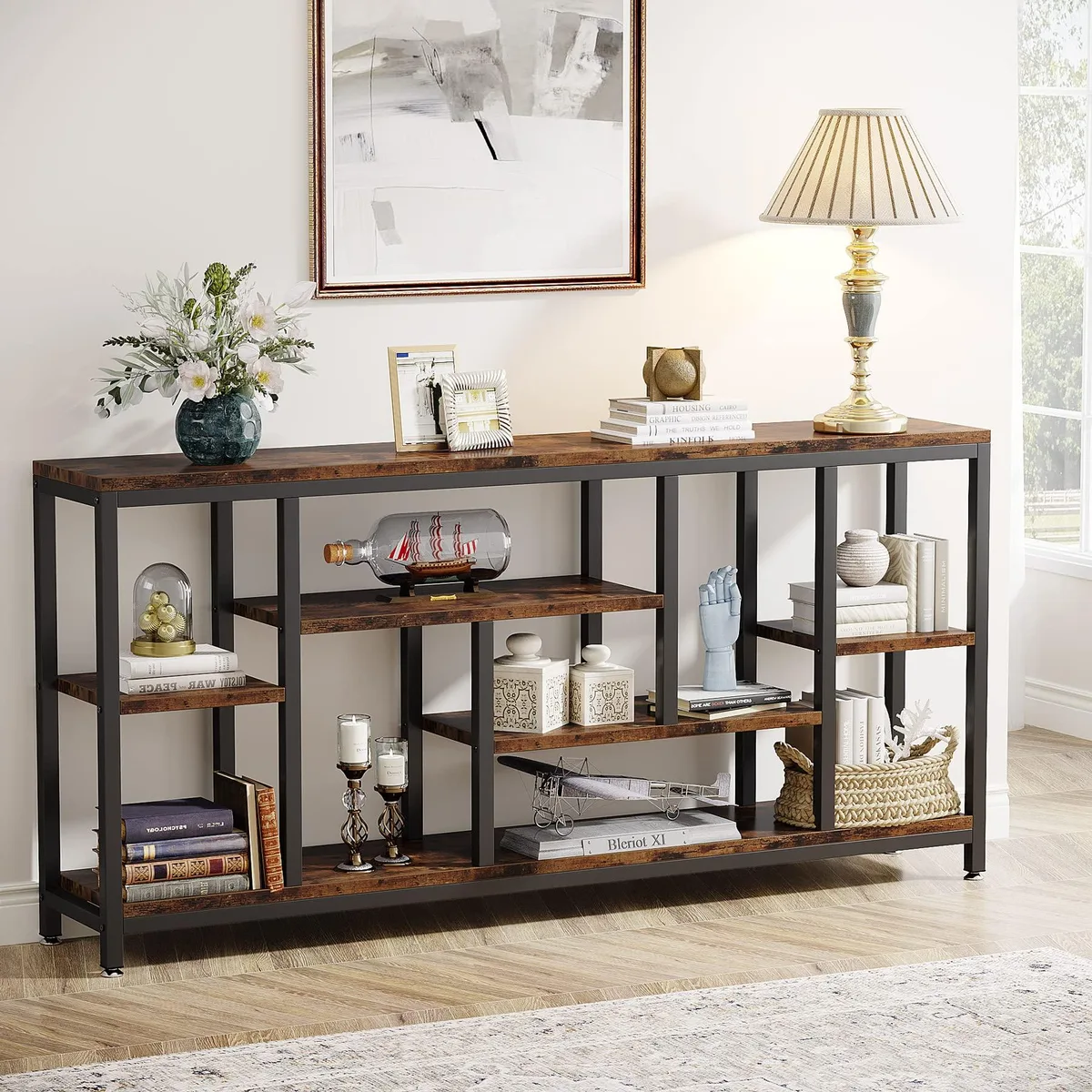 Extra-long rustic brown console table with black metal frame and three open shelves