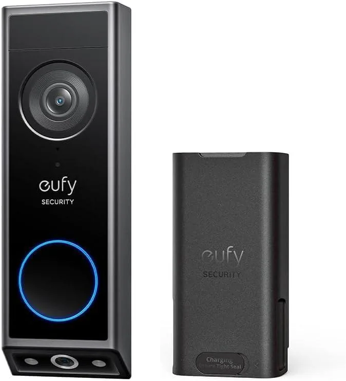 Black rectangular video doorbell with dual camera lenses, quick-release battery pack included, matte finish