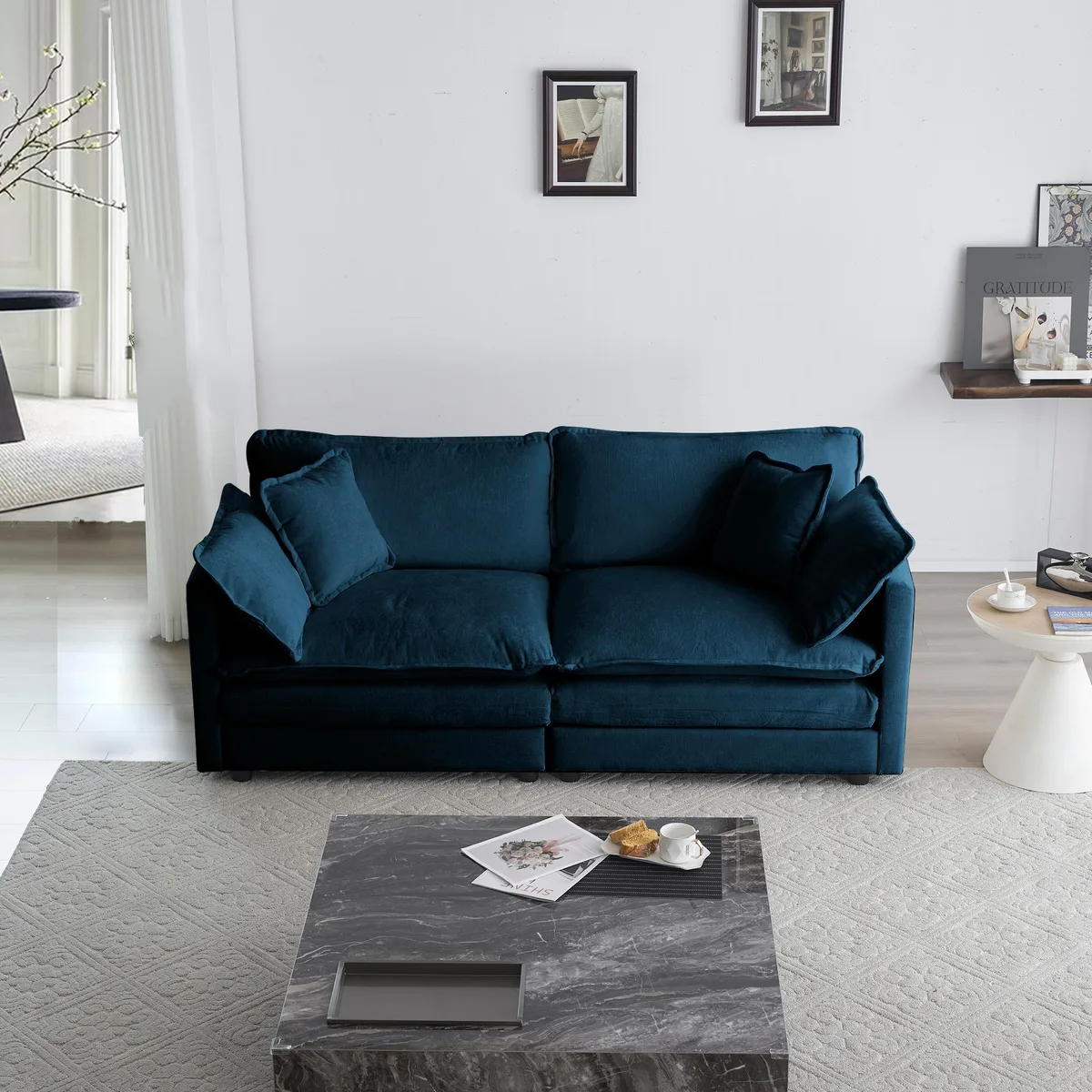 Blue chenille two-seat loveseat with four pillows